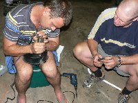 Jacques enlarging the 12mm hole with a Dremel tool. Sounded like a Dentist and I'm sure the metal filter cover was screaming in pain.