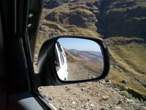 Looking forward and seeing where we had already been on the pass (in the mirror).